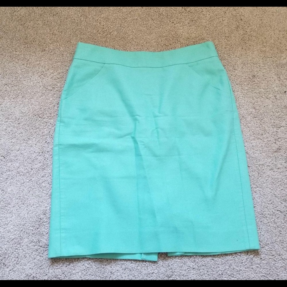 Brand new pencil skirt in beautiful teal color. Never worn and still has tags.
